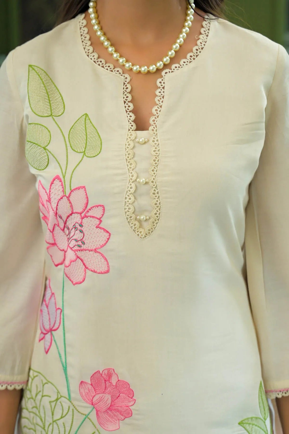 Beige kurta with floral embroidery and pearl necklace