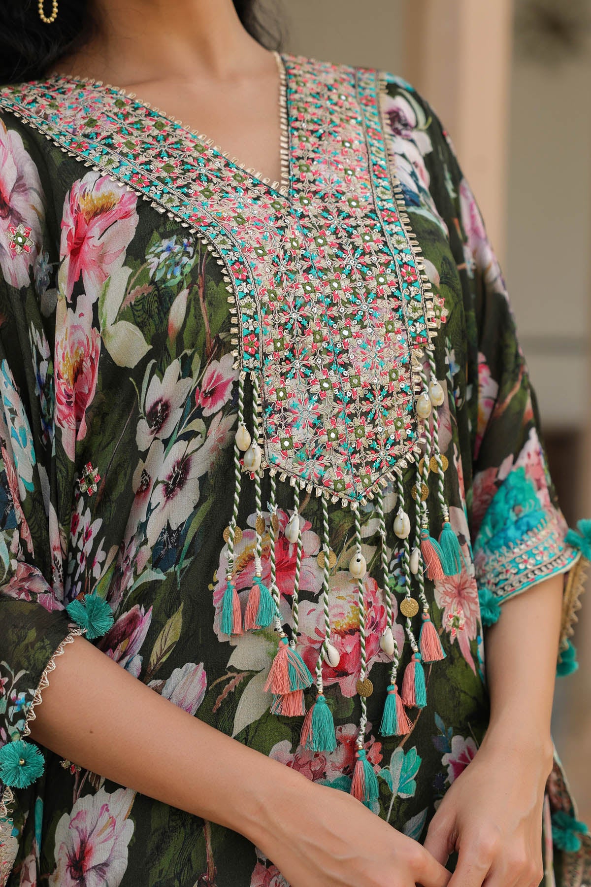 Floral dress with intricate beadwork and tassel details