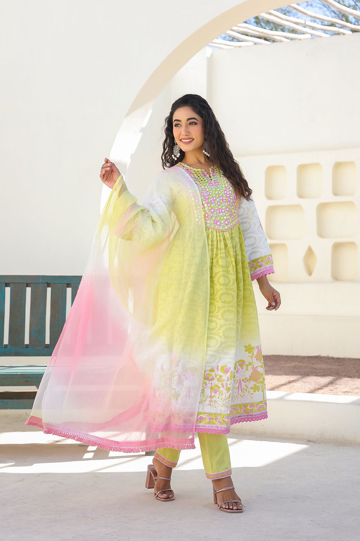 Woman wearing a colorful traditional outfit with a white background