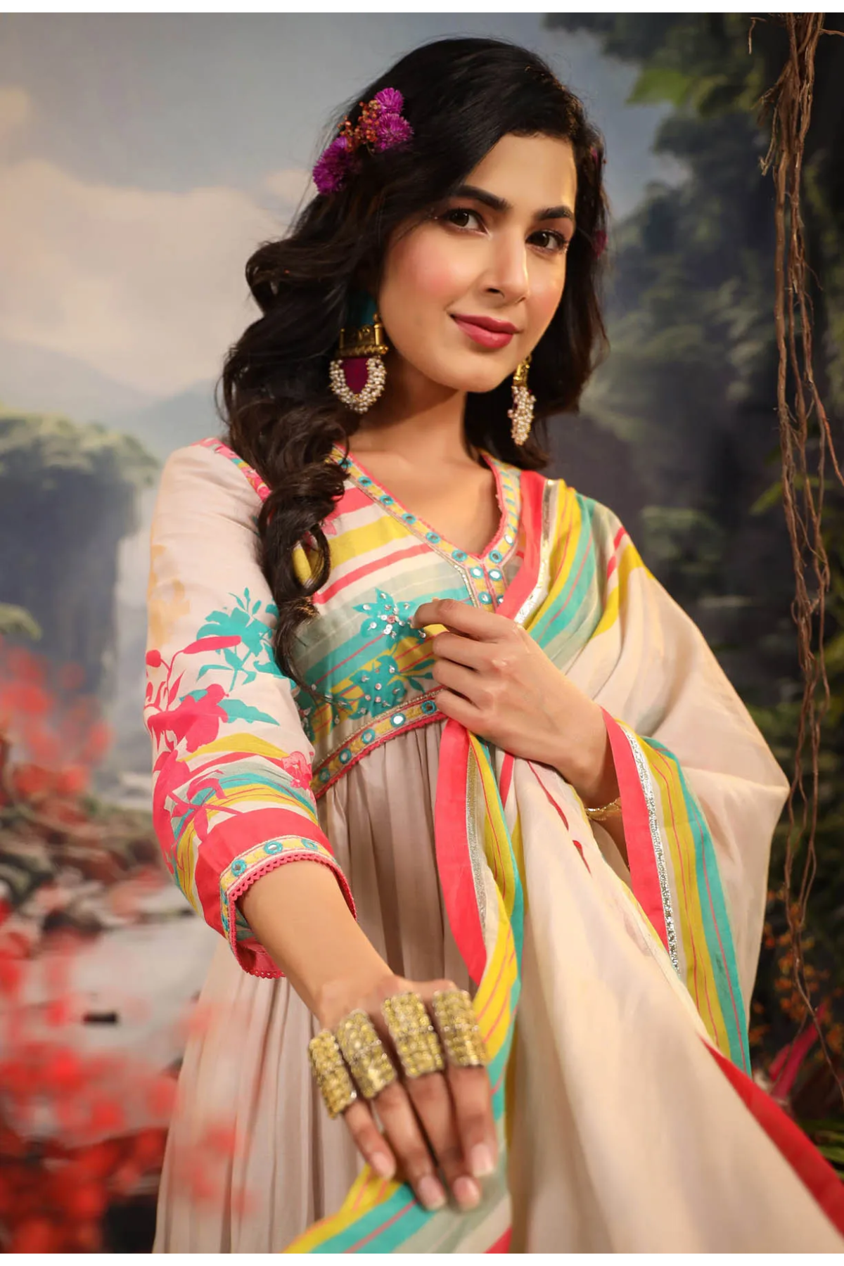 Woman in a colorful traditional outfit with a scenic background