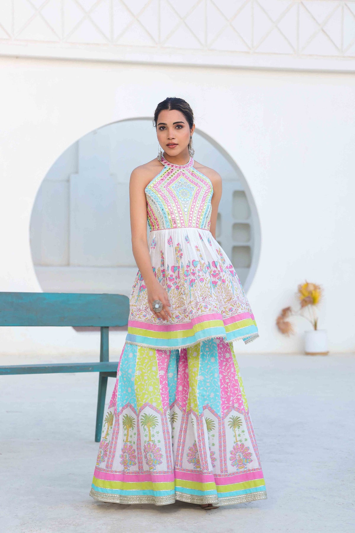 Woman wearing a colorful dress with a white background