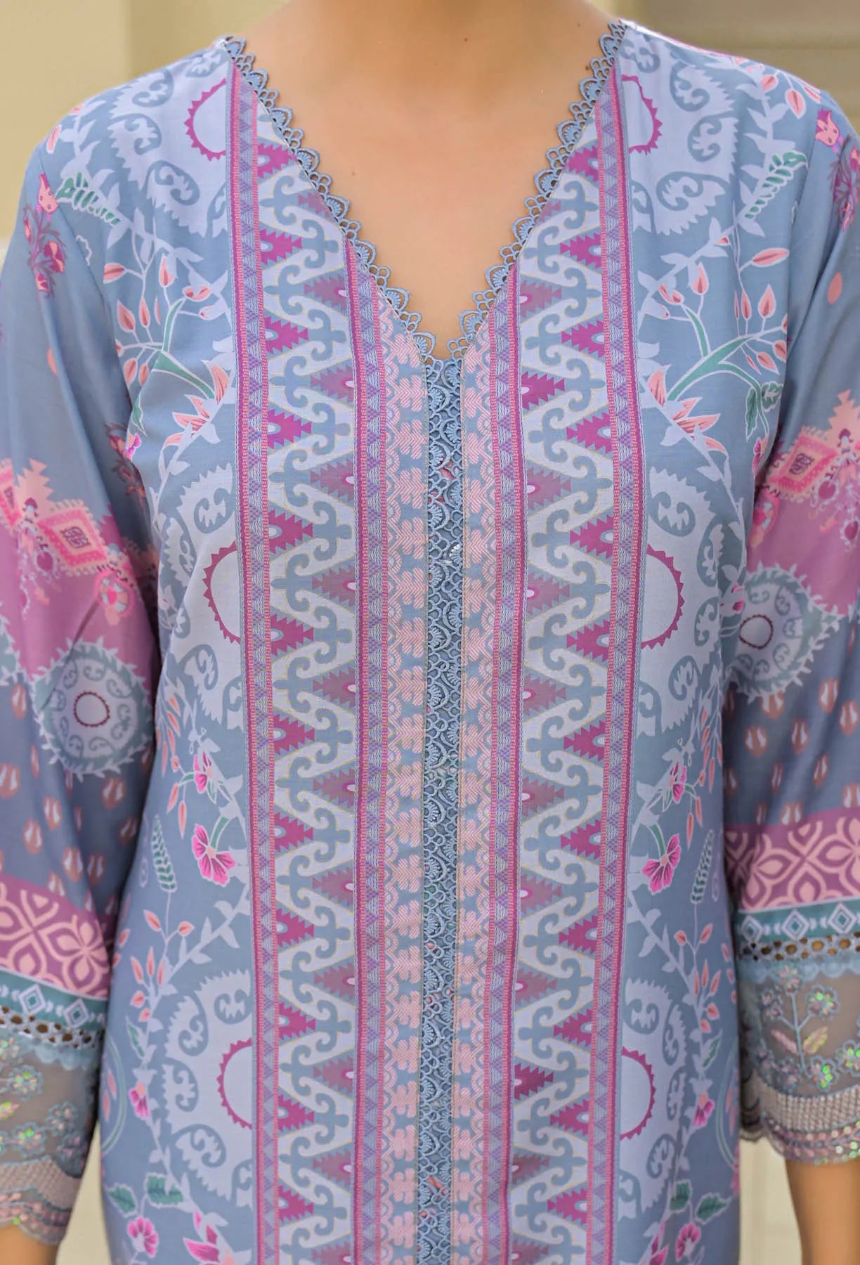 Patterned shirt with a focus on the neckline and sleeves.