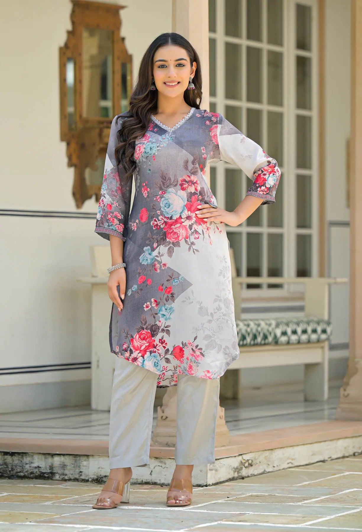 Woman wearing a floral dress with a neutral background