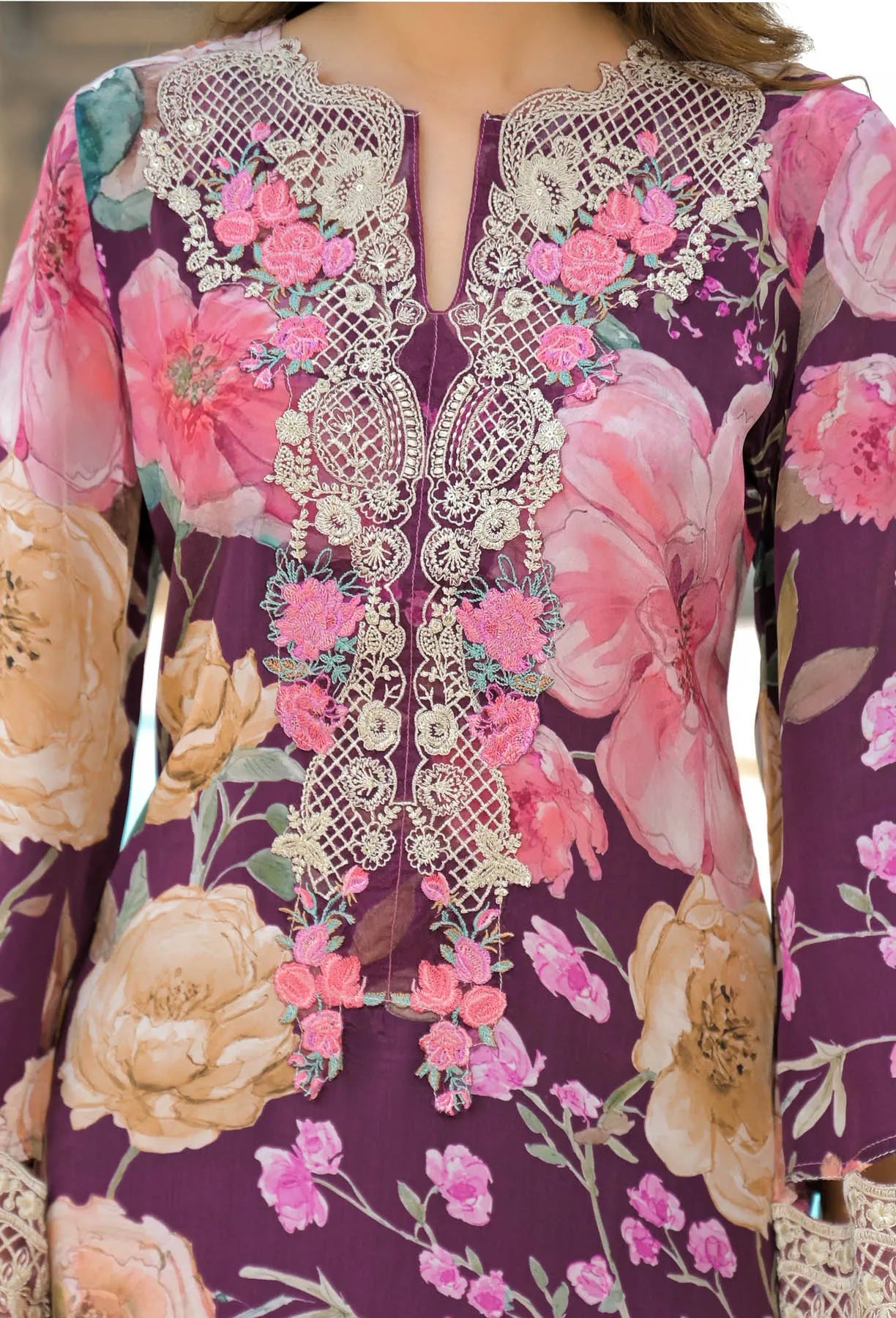 Floral dress with intricate lace detailing on a purple background