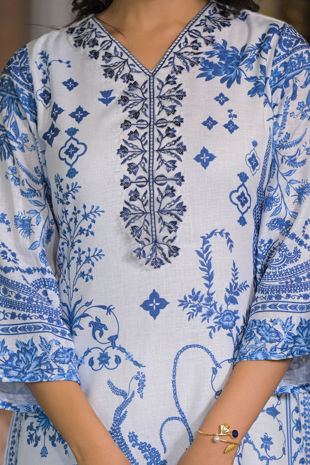 White kurta with blue floral embroidery