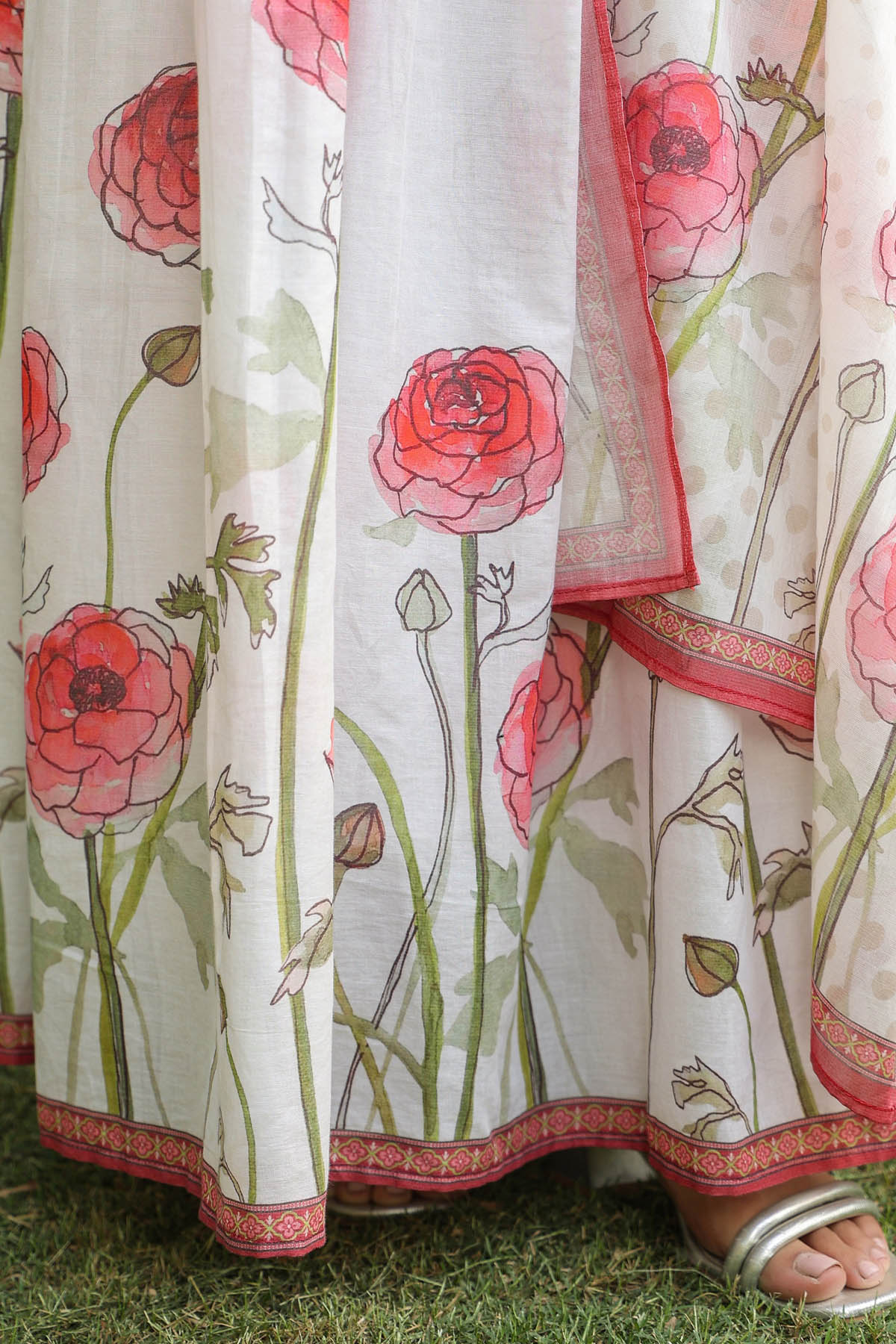 Floral-patterned fabric with pink flowers on a white background