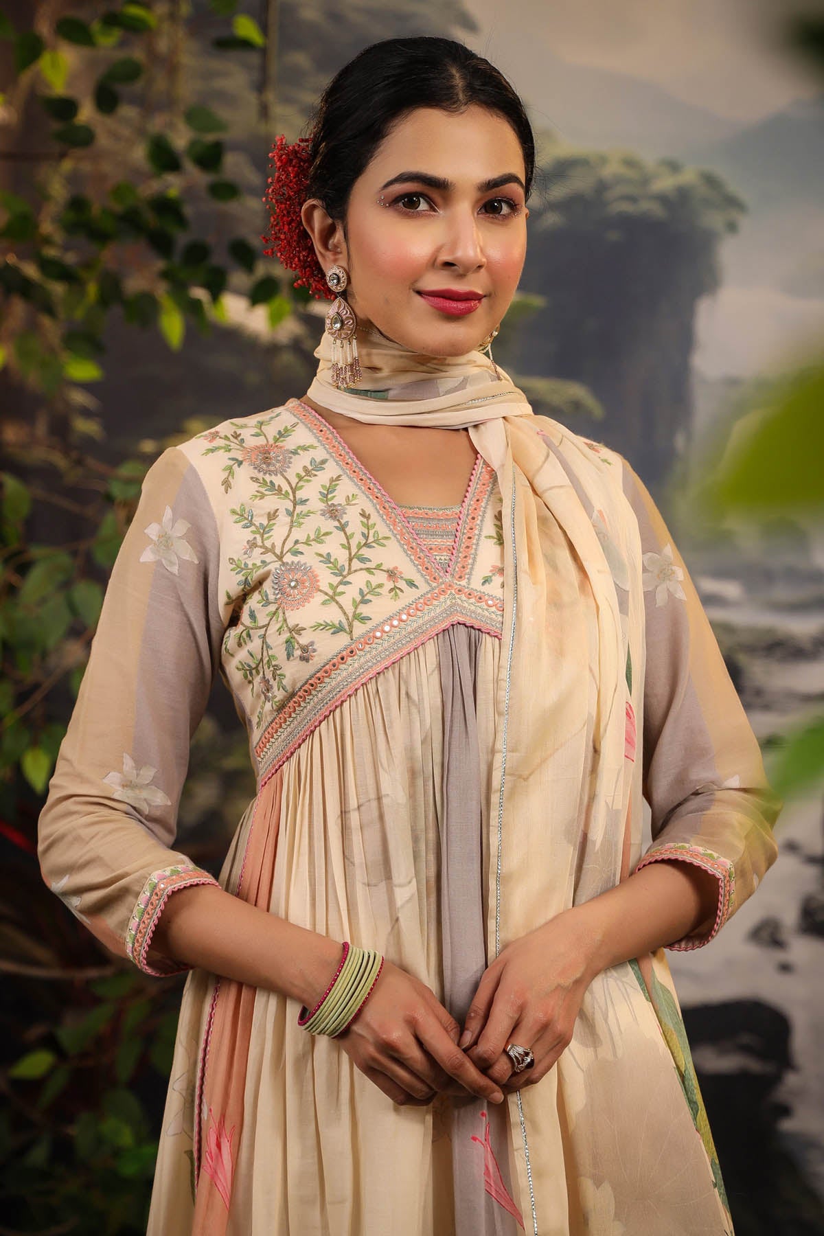 Woman in traditional attire with a scenic background