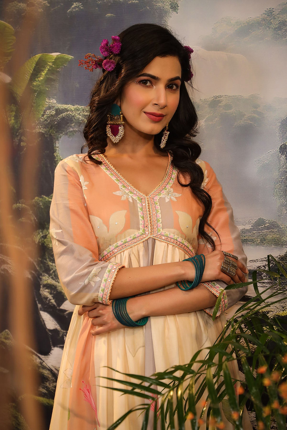 Woman in traditional attire with a scenic background