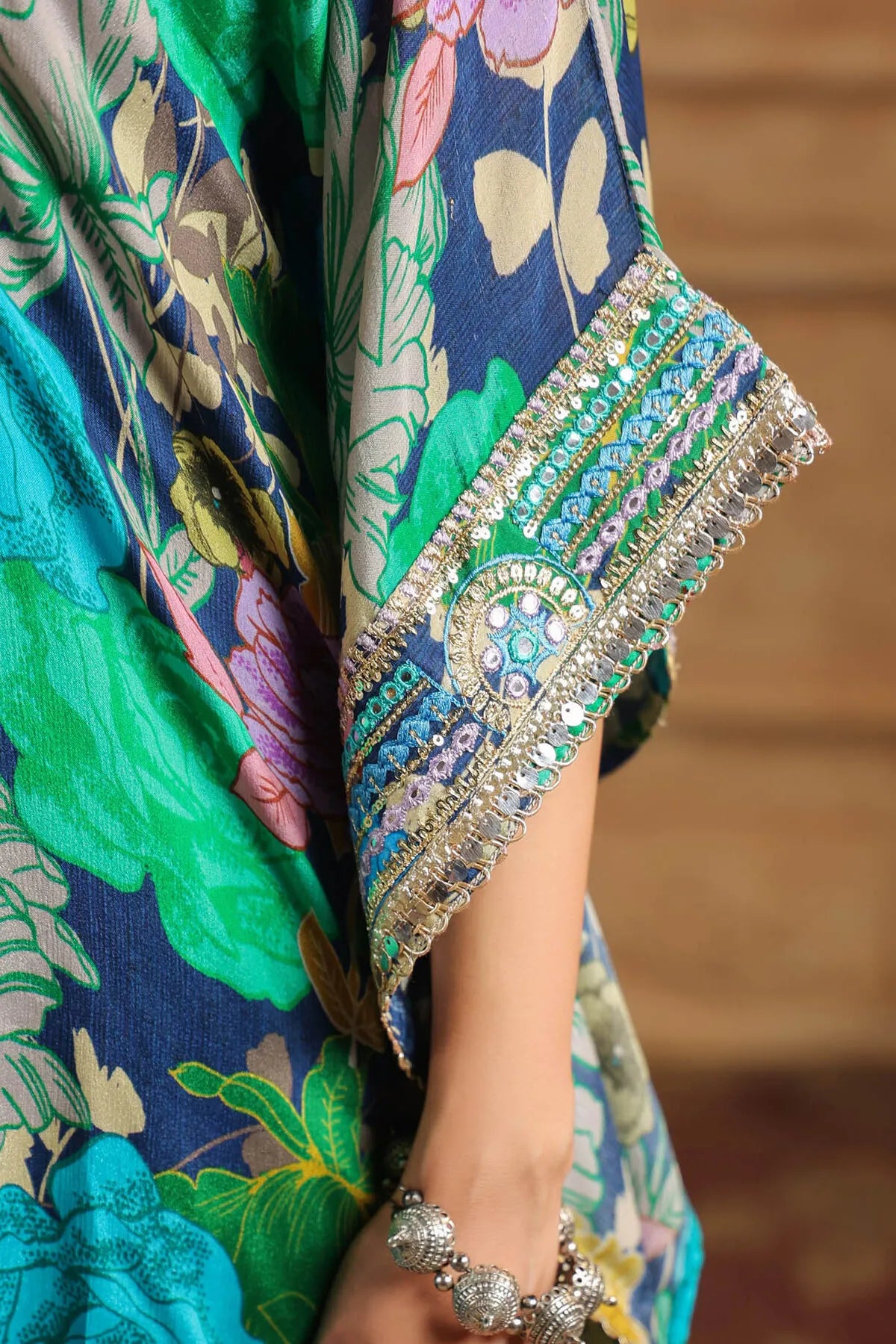 Close-up of a colorful traditional garment with intricate patterns and embroidery.