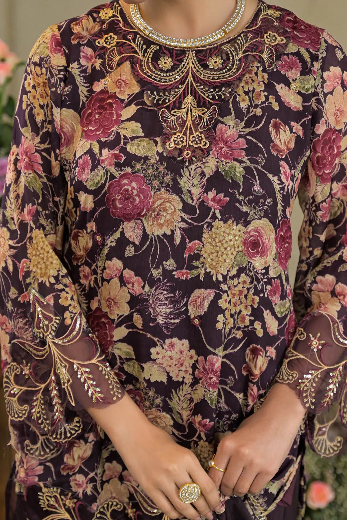 Floral and paisley patterned garment with intricate details