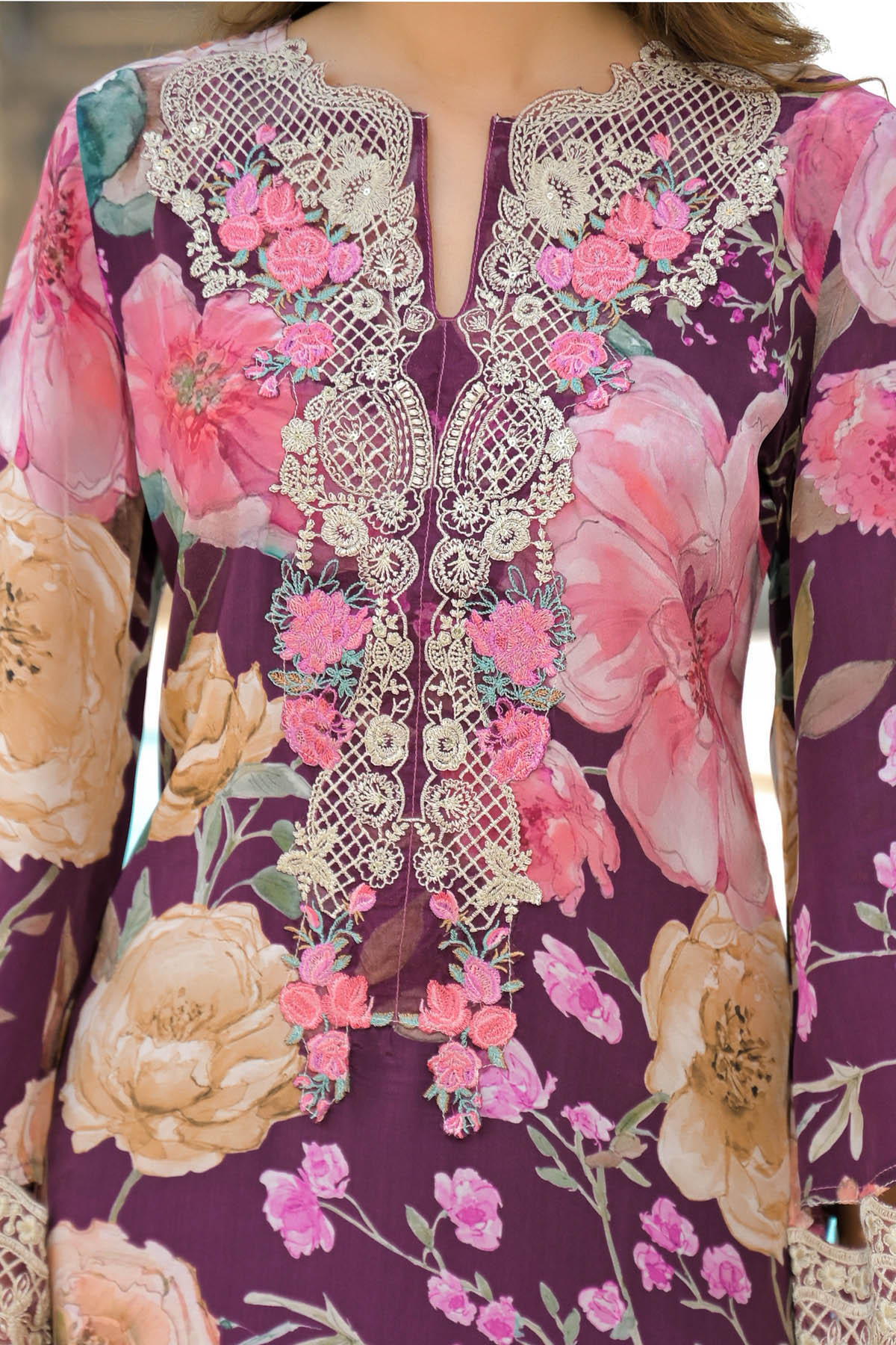 Floral embroidered dress with intricate patterns on a purple background