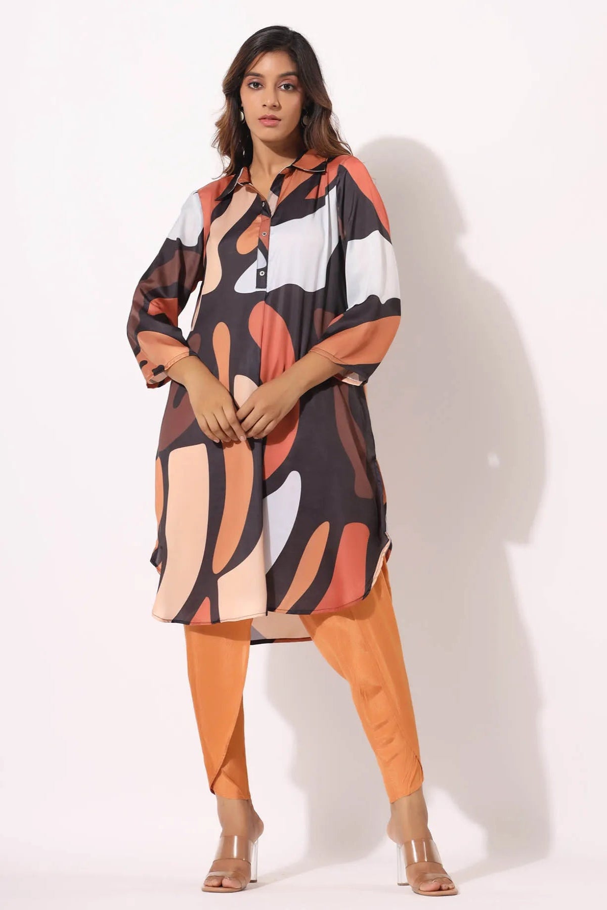 Woman wearing a colorful dress with a white background