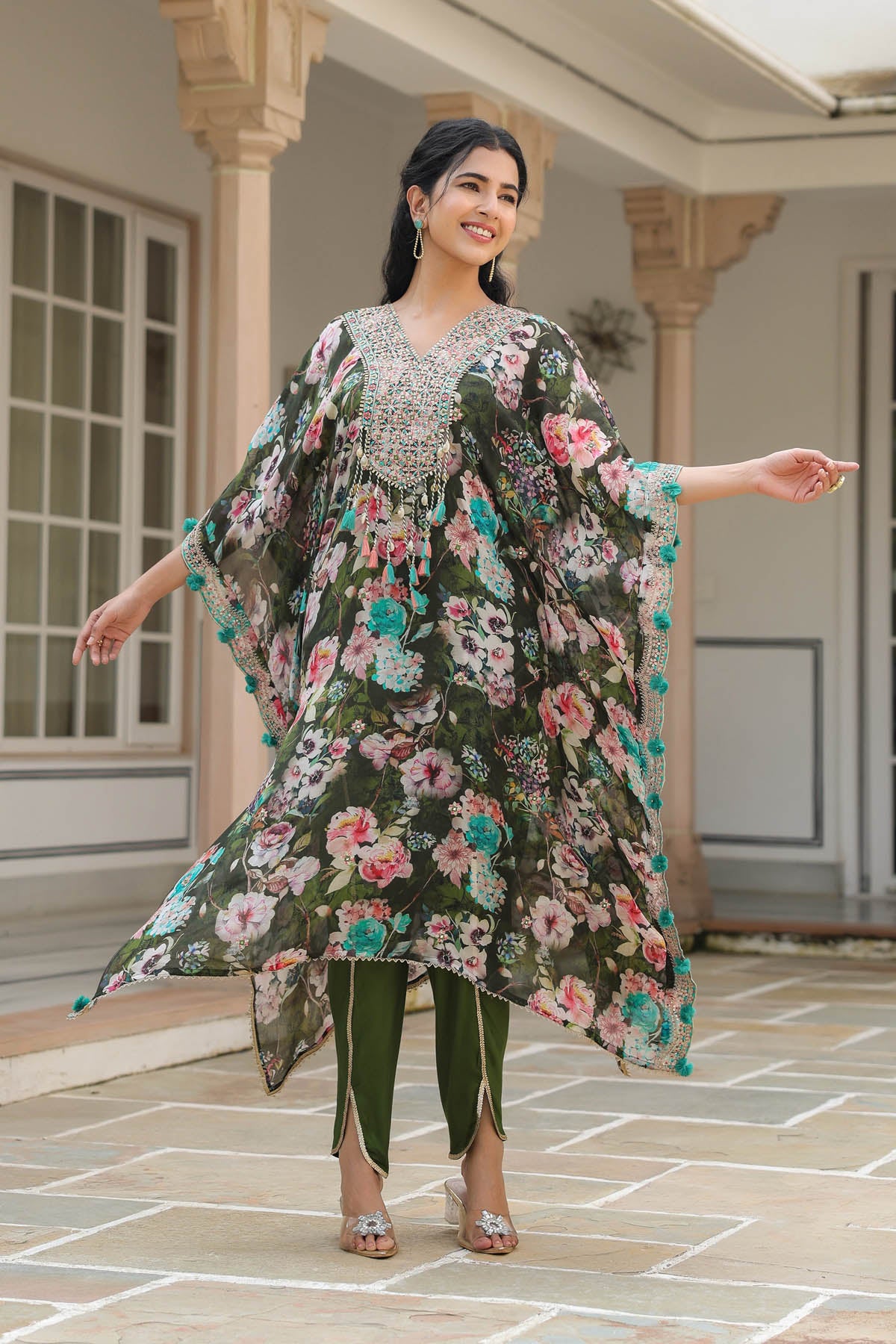 Woman wearing a floral dress with a patterned background