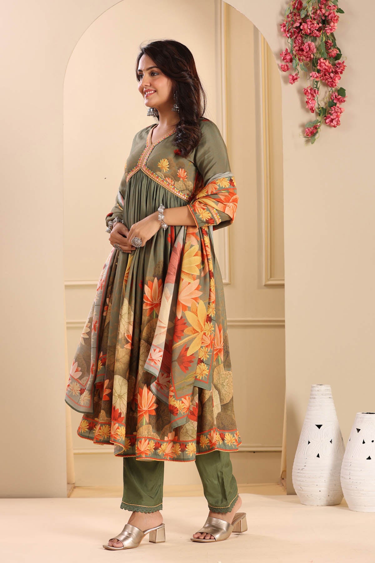 Woman wearing a floral dress with a neutral background