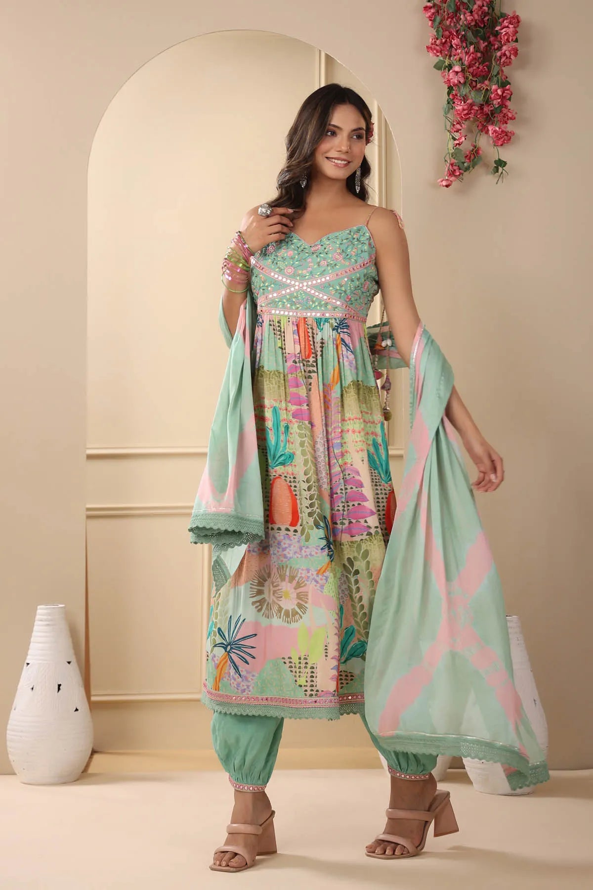 Woman wearing a colorful traditional outfit with a floral background