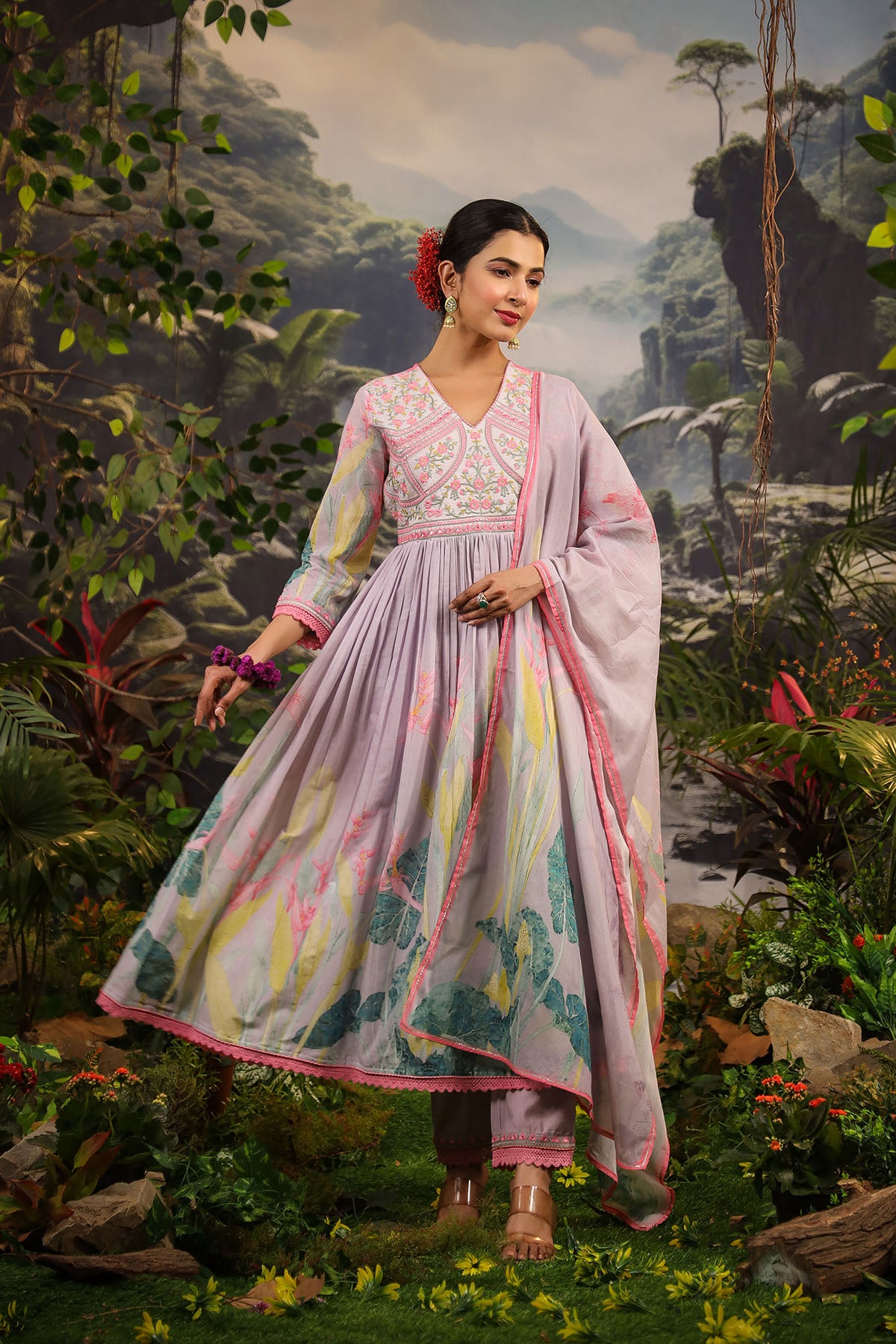 Woman in a traditional outfit standing in a lush, animated jungle setting