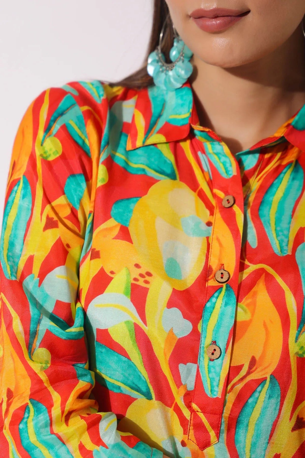 Close-up of a colorful floral patterned shirt with a blurred background