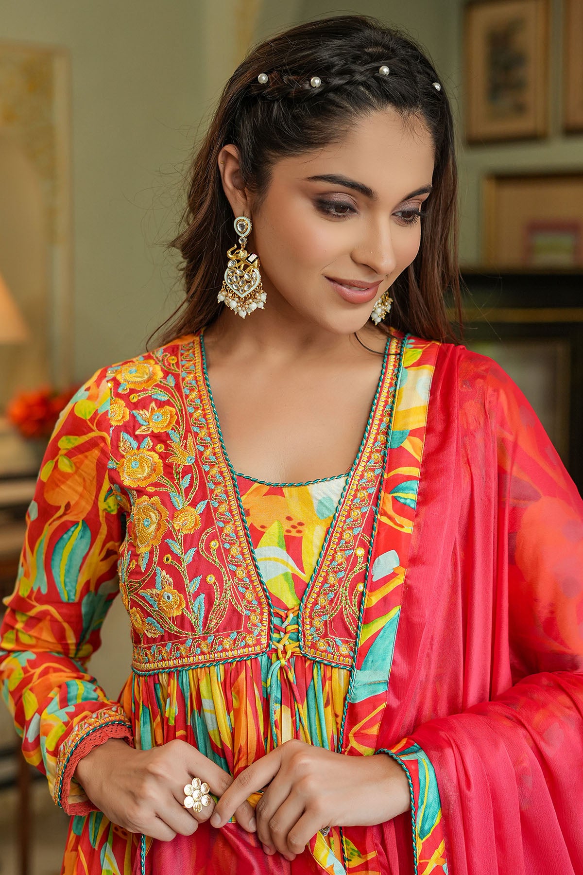 Woman wearing a colorful traditional outfit with intricate patterns