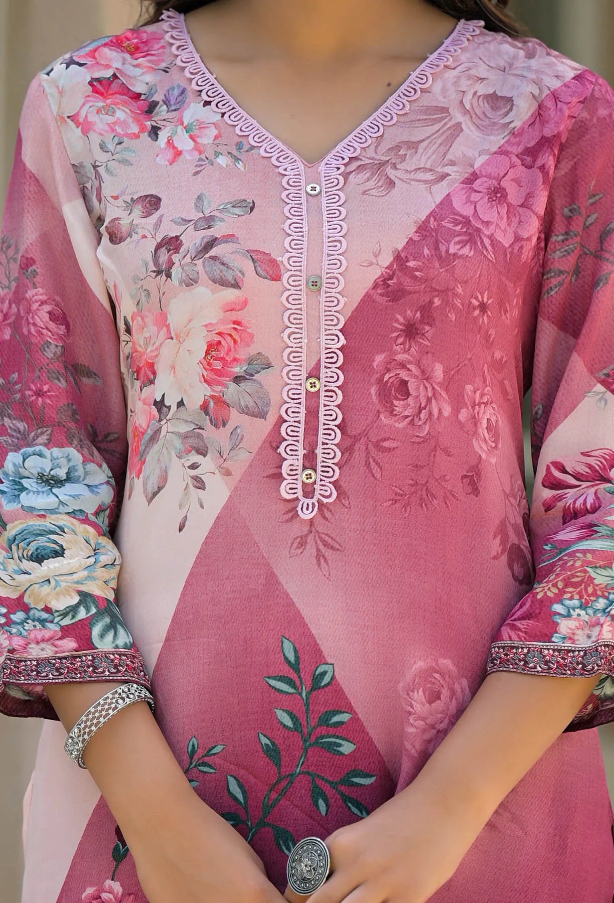 Close-up of a pink floral embroidered traditional outfit