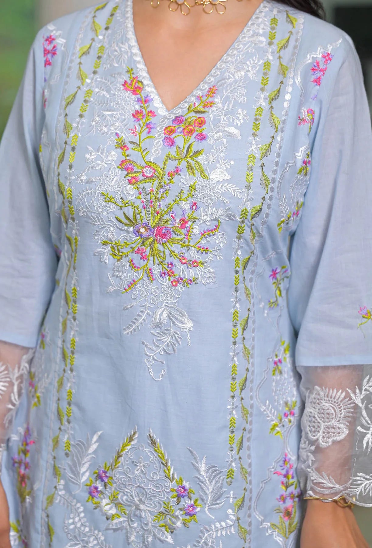 Light blue embroidered dress with floral patterns
