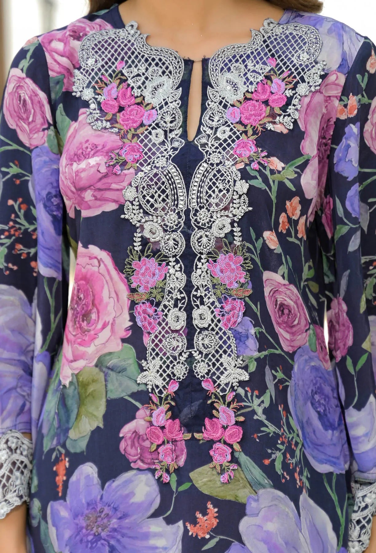 Navy blue dress with floral patterns and intricate white embroidery