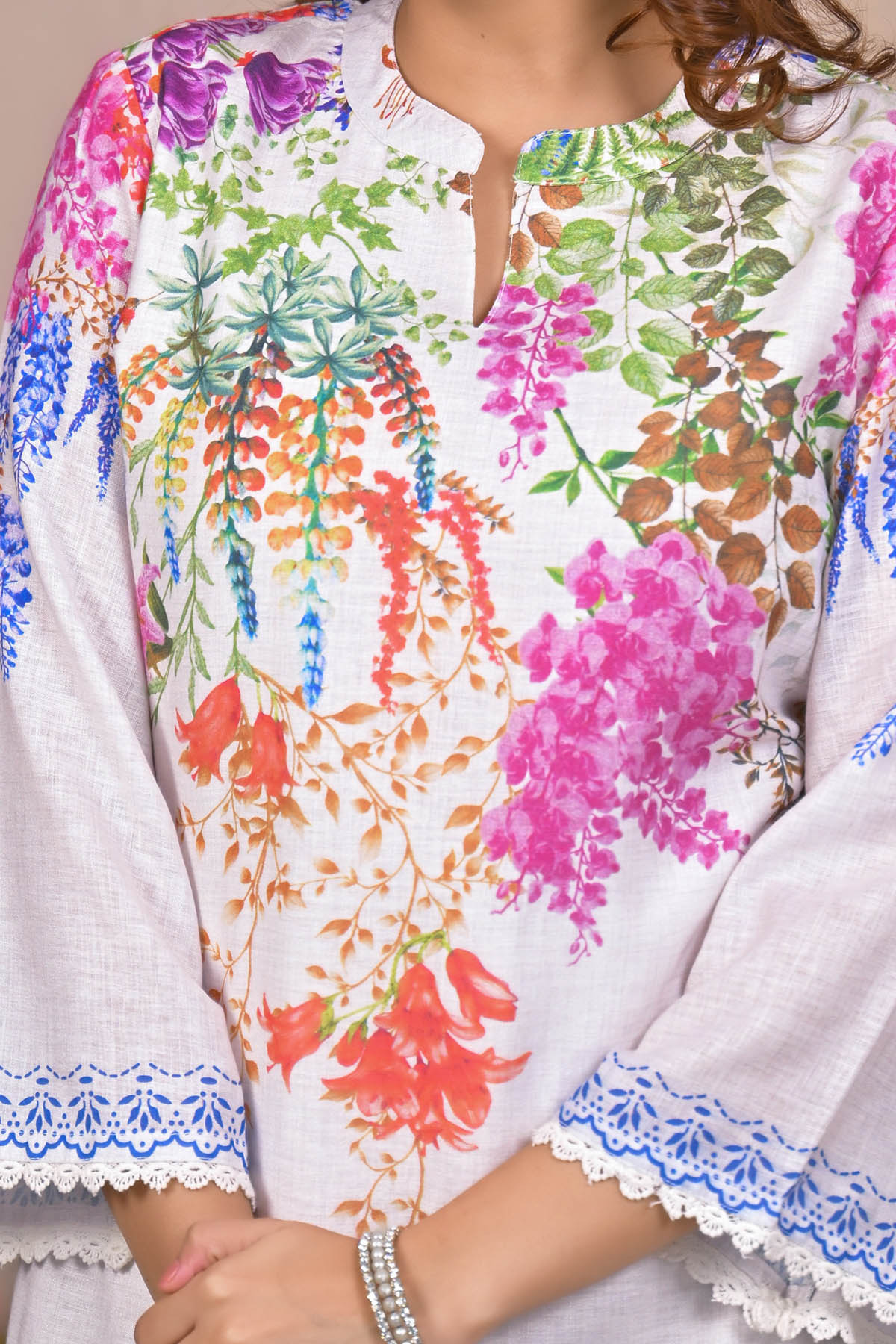 Colorful floral patterned shirt with white collar and cuffs