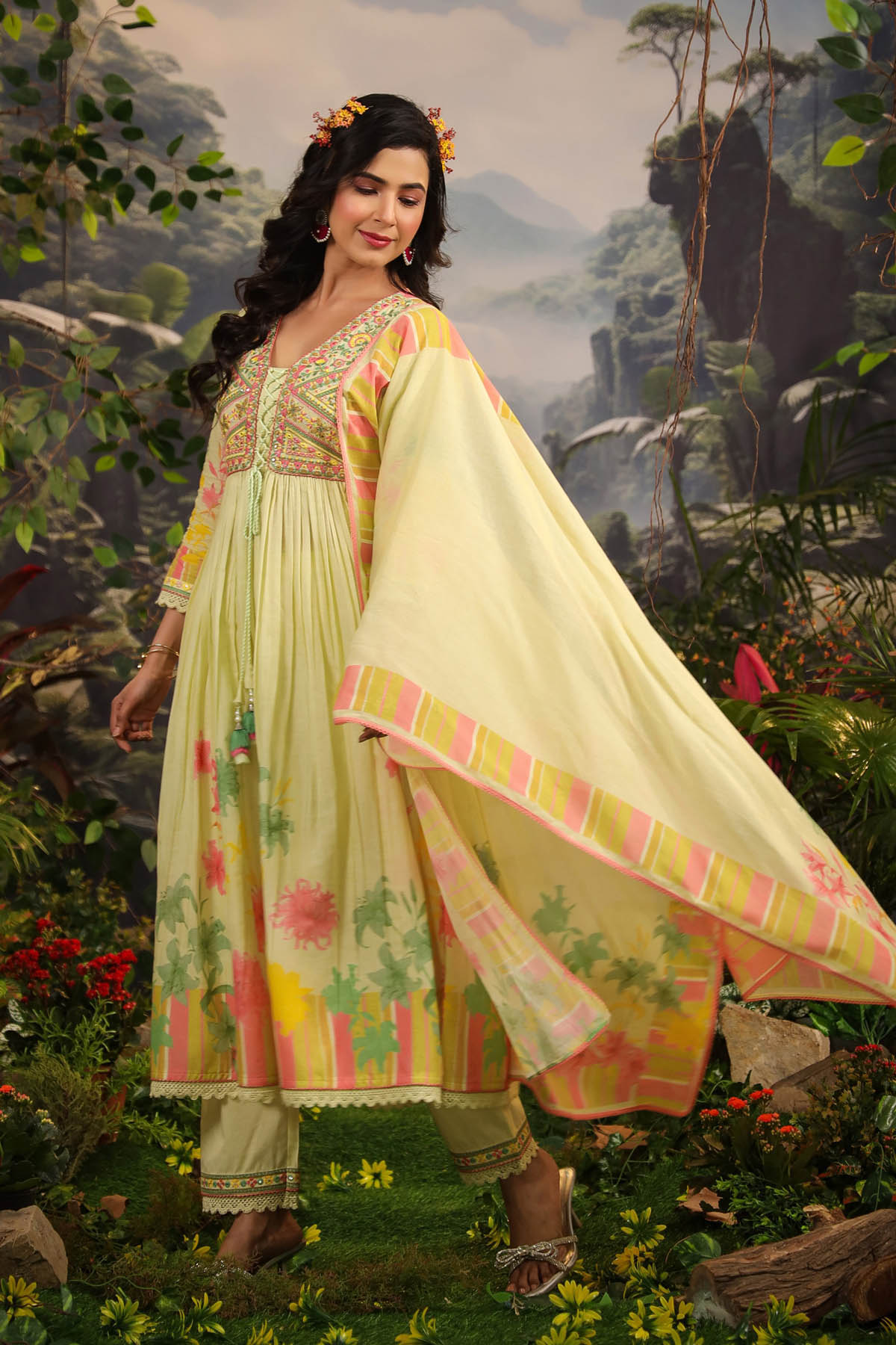 Woman in a traditional outfit with a scenic background
